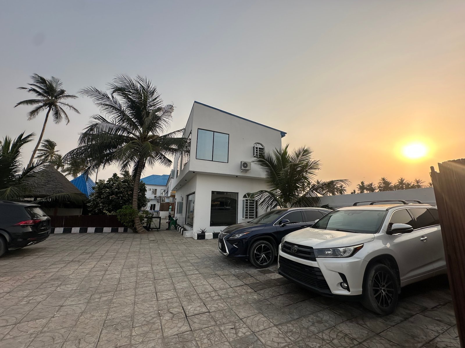 The Jet Beach Club building and parking at golden hour